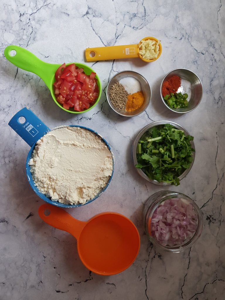 ginger,tomatoes,onions,chickpea flour,coriander,onion,chilli, spices,water