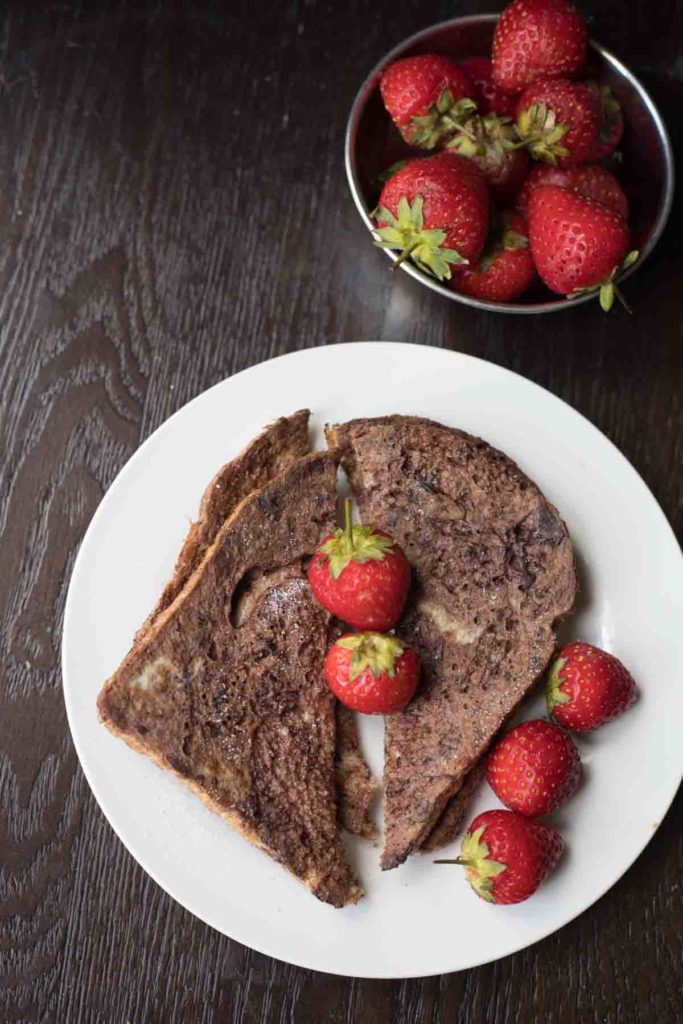 Chocolate french toast served with strawberries