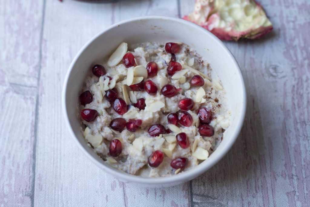 Instant Pot Millet Porridge served with almond flakes and pomegranate seeds 