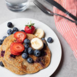 banana pancakes served with fruit