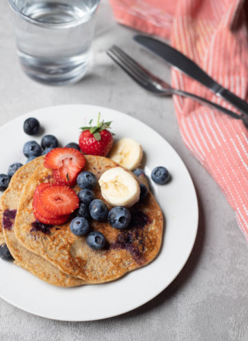 banana pancakes served with fruit