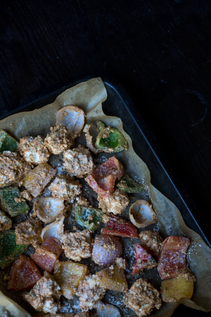 marinated paneer cheese and vegetables on a baking tray