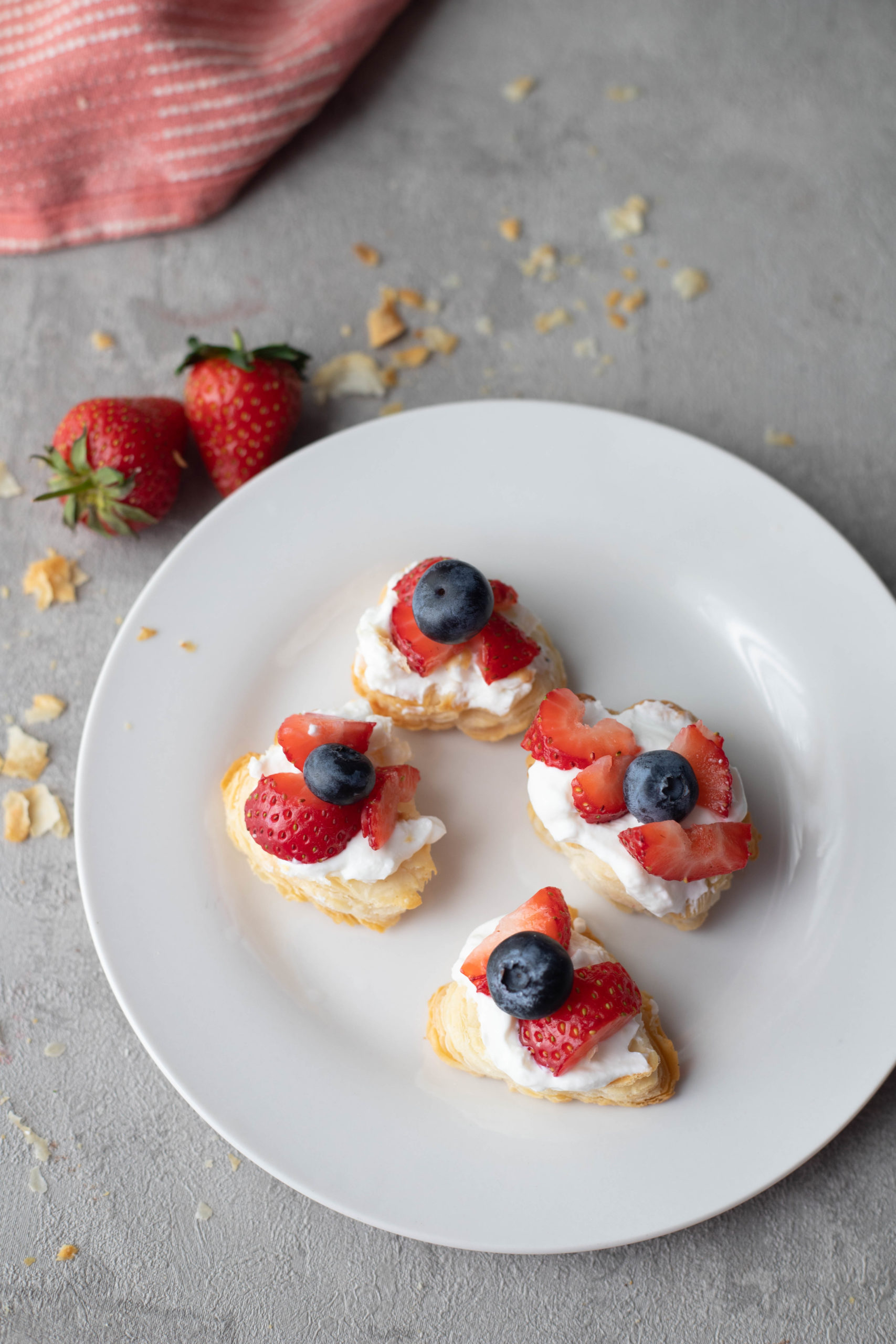 puff pastry bites with cream and berries