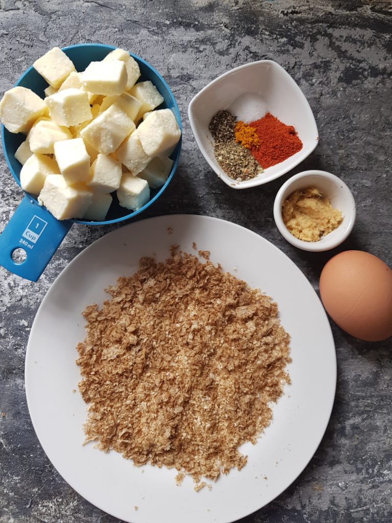 paneer popcorn ingredients - paneer cubes, spices, ginger garlic paste,egg, breadcrumbs