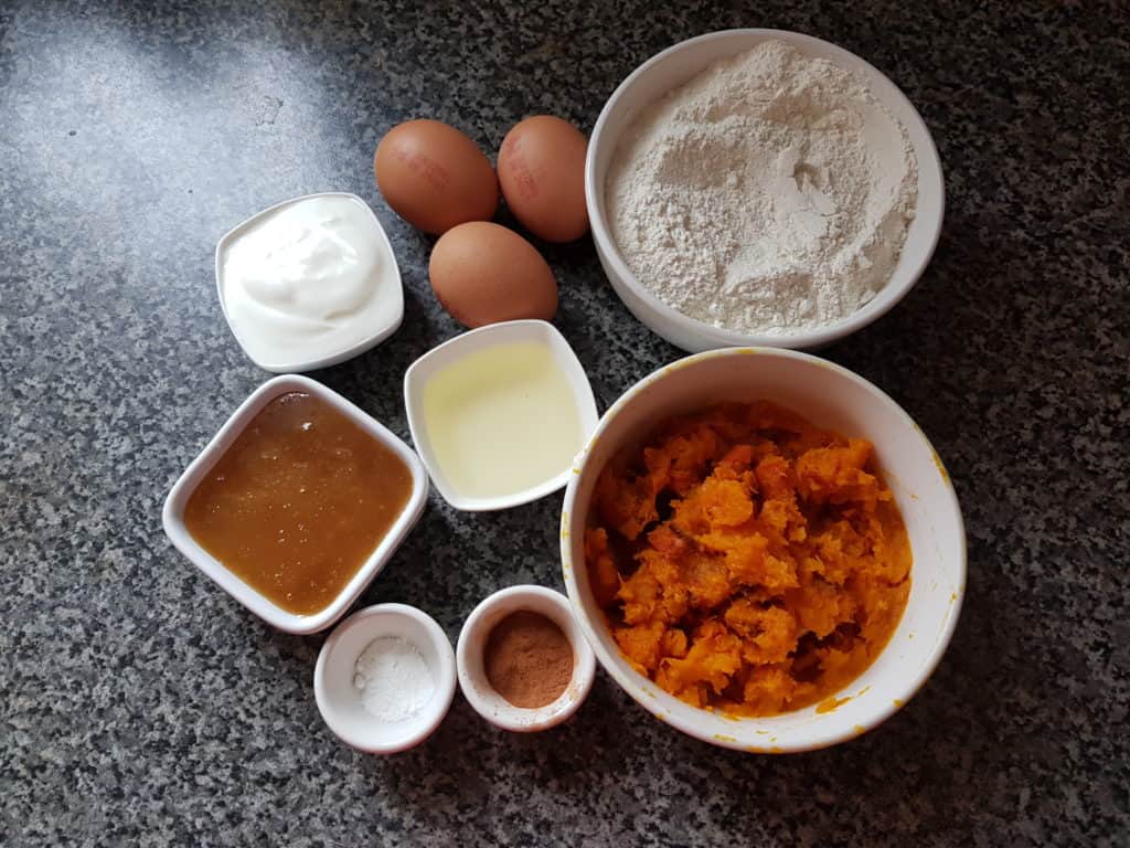 ingredients for butternut squash cake - honey, flour, squash puree, eggs,cinamon powder, oil,yogurt