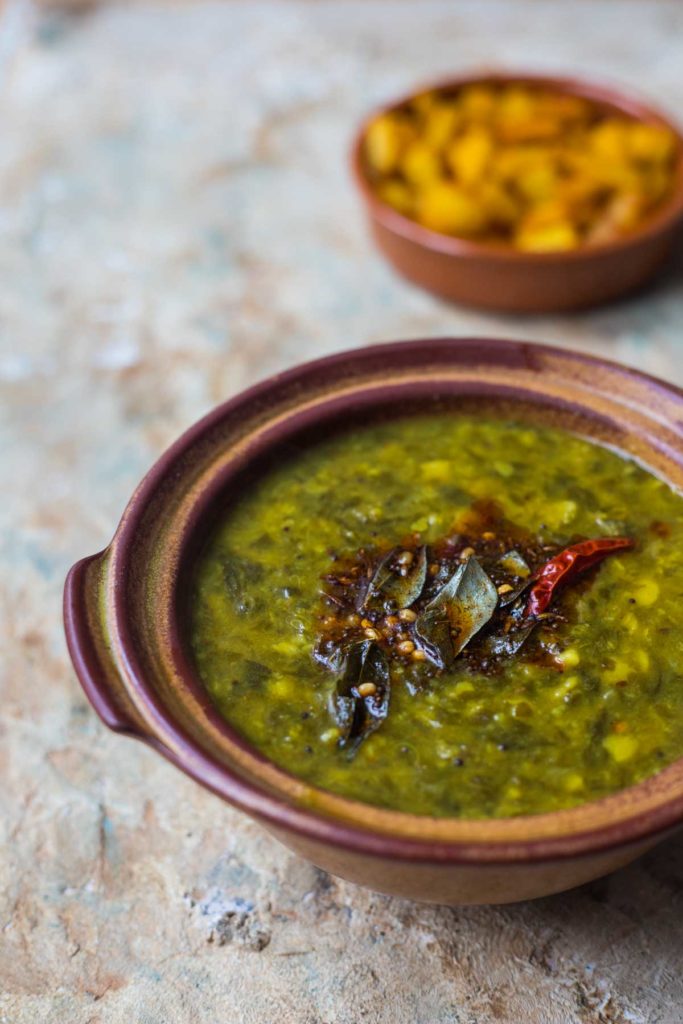 andhra gongura pappu served in an earthern pot and a potato side