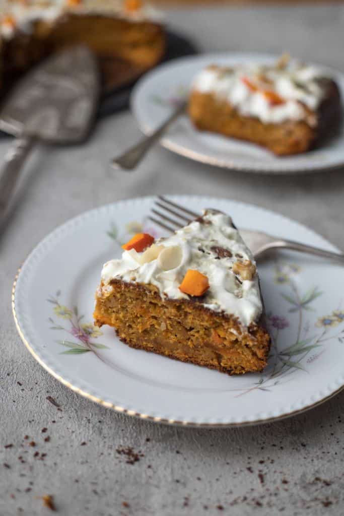 a slice of butternut squash cake served on a plate with fork