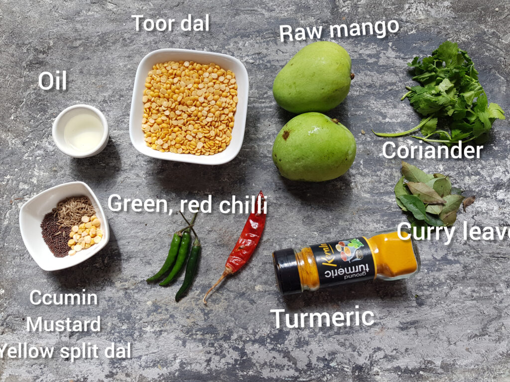 ingredients for raw mango dal recipe, mangoes, toor dal, chillis, oil, coariander, curry leaves, ground turmeric, cumin, mustard