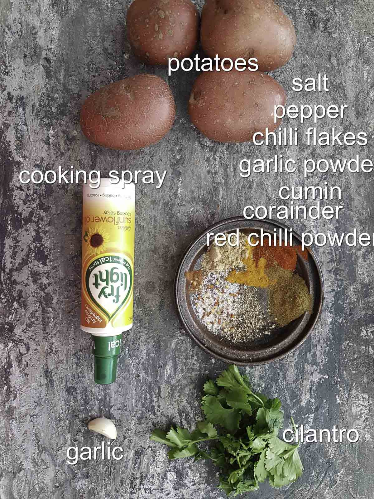 ingredients for Moroccan roasted potatoes recipe, potatoes, spices, garlic, cooking spray, cilantro