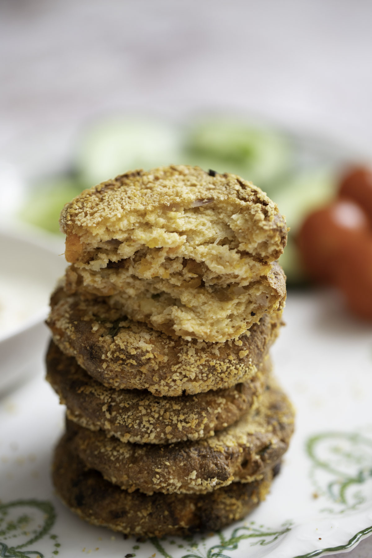 a stack of paneer cutlets showing the inside texture