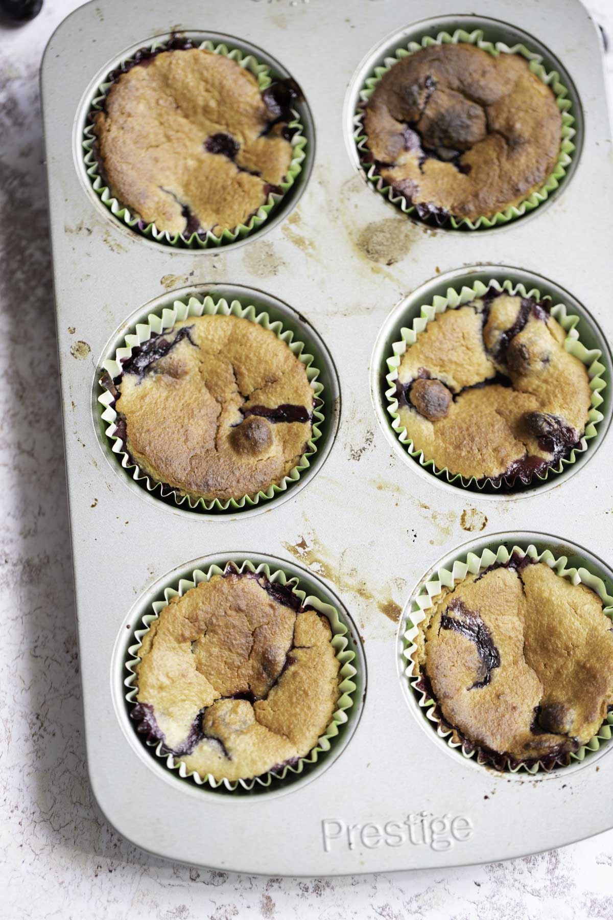 baked  lemon blueberry oatmeal muffins in  a lined baking tray