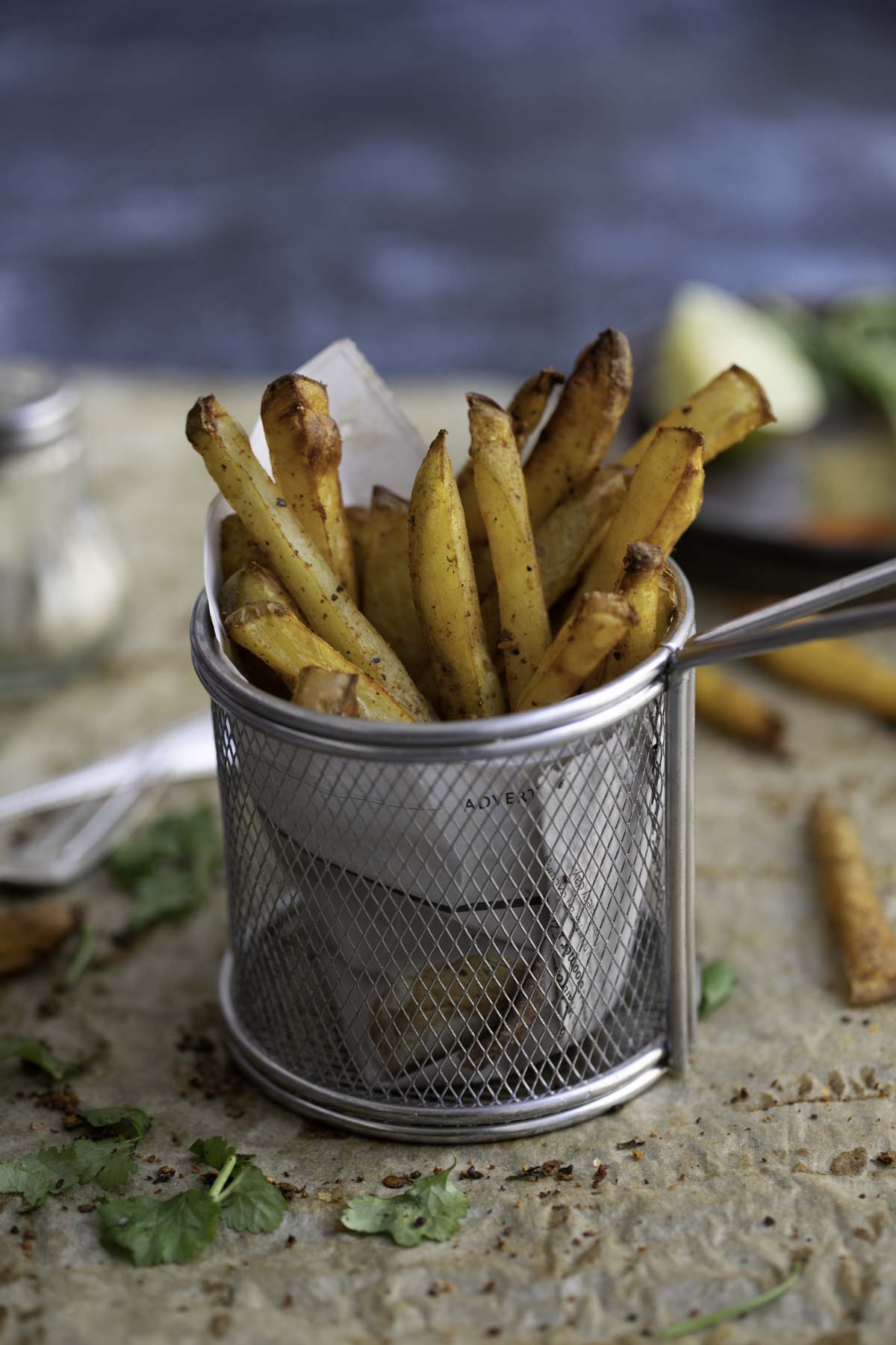 masala fries in a wire rack basket