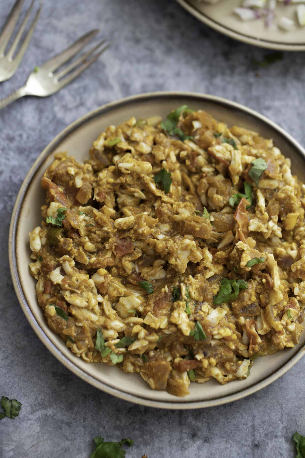 egg keema on a plate with 2 forks in the background