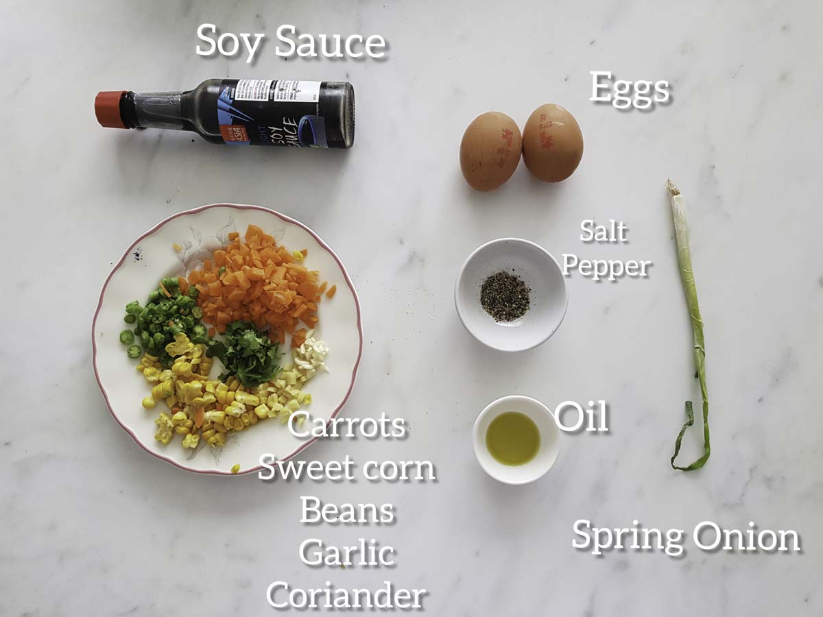 ingredients for barley egg fried rice, veggies, eggs, pepper, oil