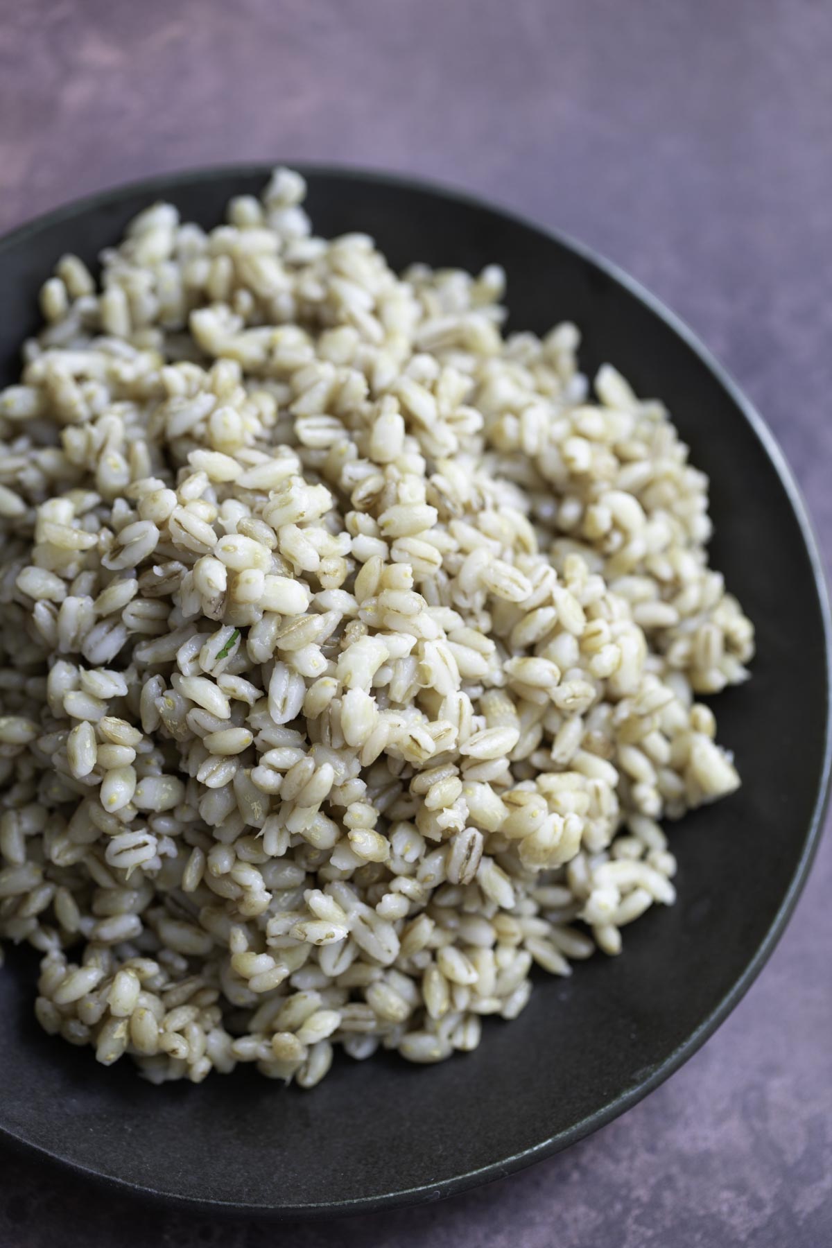 a plate of cooked pearl barley grains