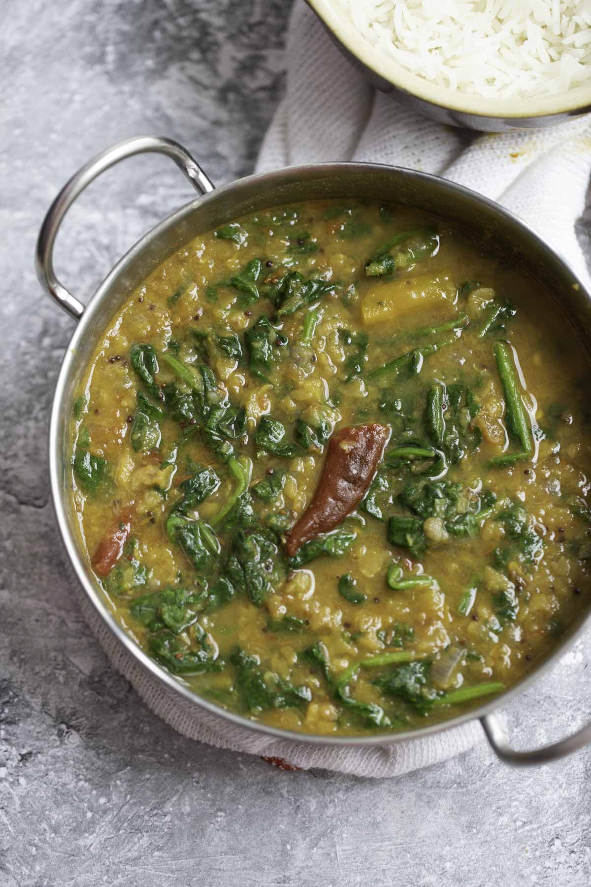 spinach dal served in a steel kadai
